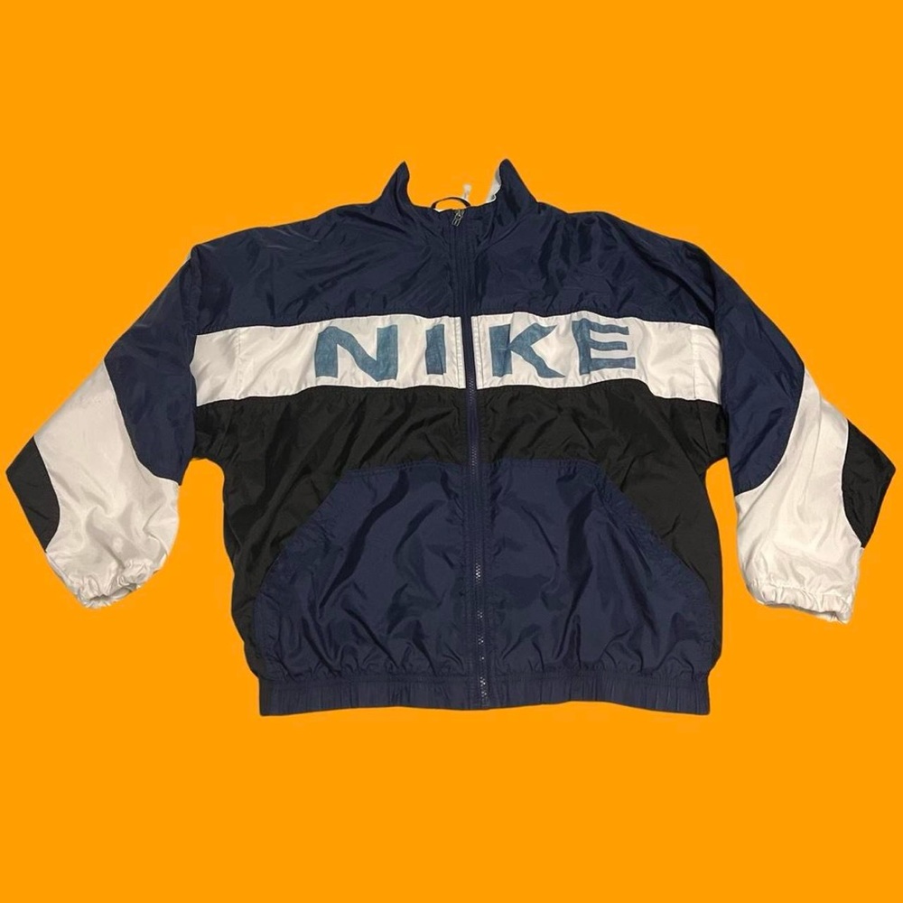 Vintage 90's Nike Spell Out Nylon Zip Up
Windbreaker